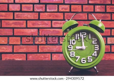 Clock on Wooden Floor with Brick Wall Background , Vintage Style