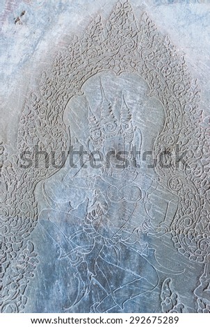 bas-relief of an apsara in a wall of a gallery of the first enclosure in the archaeological place of angkor wat in siam reap, cambodia