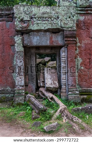 door in ruins in the archaeological ta prohm place in siam reap, cambodia
