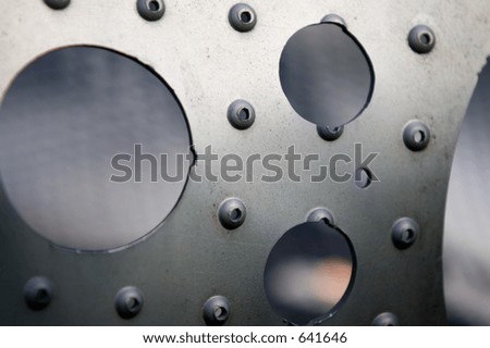 Abstract Art: Circles of Cold Hard Metal.  Great perspective of cold hard metal