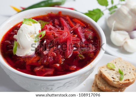 Russian speciality Borsch soup with beetrots and sour cream. Russian speciality