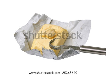 Block of butter with Butter curls on a silver paper