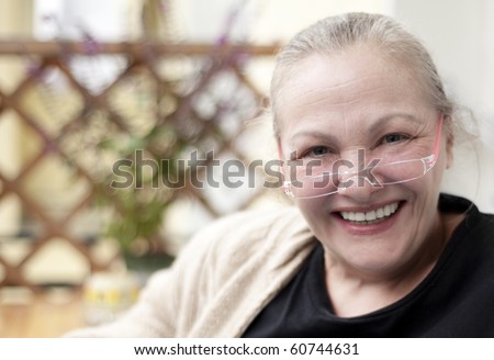 stock photo A portrait of a beautiful mature blond woman smiling