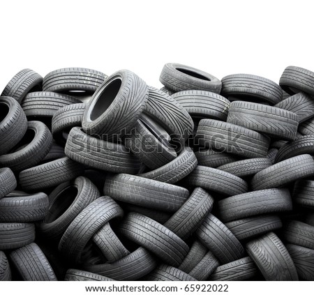 Wall of old car tires on white background