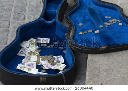 Guitar case with money in it
