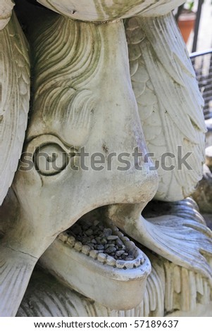 The closeup of fish sculpture in the Boboli gardens