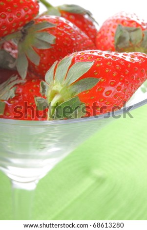 The sweet fresh red  strawberry in the martini glass