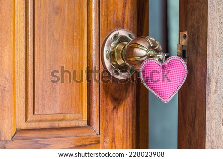 close up key of love on door handle, doorknoob