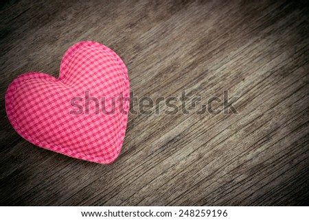 pink heart love shape on wood background