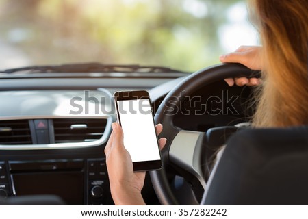 woman holding phone in car clipping path white screen