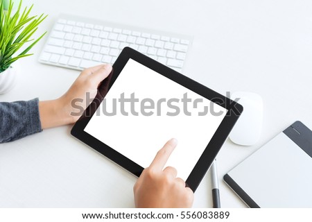 hand using digital tablet finger touch blank screen on desk work table