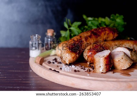 Barbecue tongs with sausages
