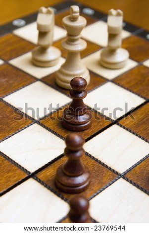 chess pawns attack the king