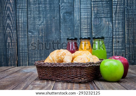 bread in a basket with variety of juice,healthy breakfast
