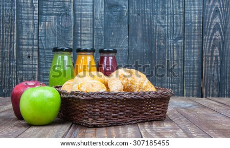 bread in a basket with variety of juice,healthy breakfast