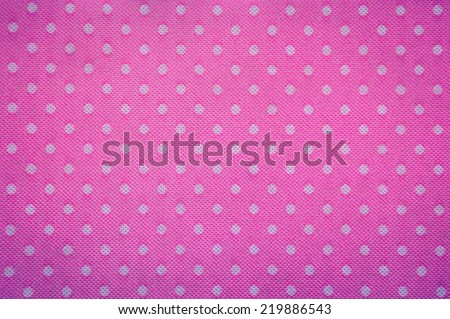 white dots and pink fabric background and texture vintage style.
