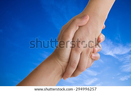 hands in the blue sky.