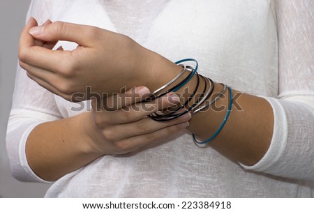 Young woman hands with jewelry, rings. / Girl hands with jewelry