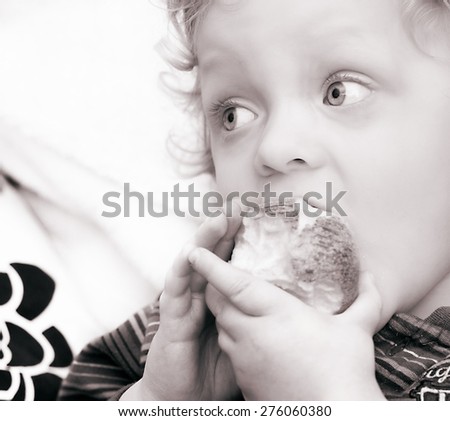 Portrait of Cute Blond Boy  with apple in black white