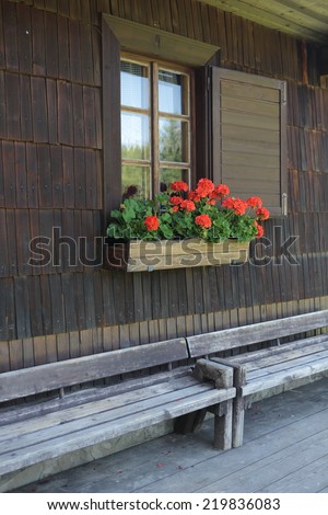 Window of historical timbered building decorated with flowers, Solan, National Protected Area Beskydy, Czech republic, Europe