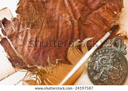 old paper with feather and ancient holder