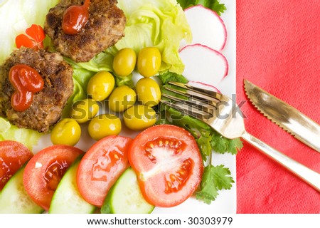dinner with olives,tomatoes and cutlets