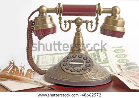 old telephone with money ,feather and letter