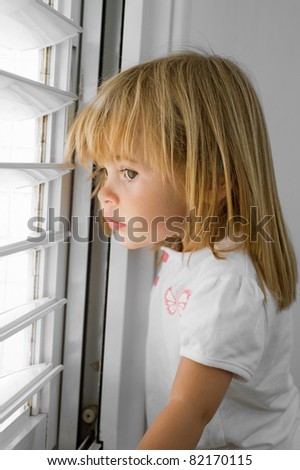 little girl at window