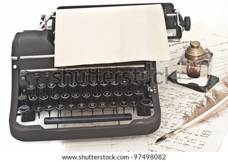 old vintage typewriter,feather,inkwell and letter
