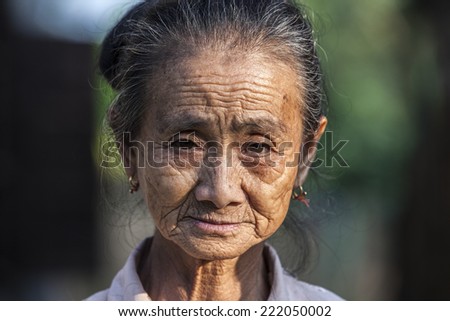 VANG VIENG, LAOS, JULY 12, 2012: Portrait of a Laotian old woman in the village of Vang Vieng in Laos.