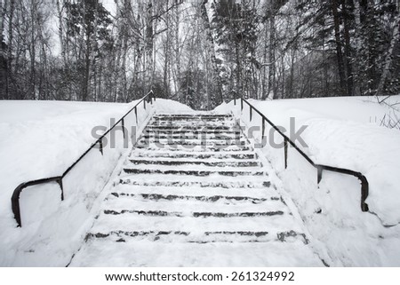 The stairs are covered in snow photo for you