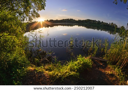 Summer sunset on the shore of the pond. Dnepropetrovsk. Ukraine