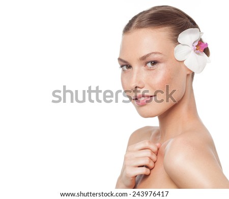 closeup portrait of attractive  caucasian woman  isolated on white studio shot lips  face head and shoulders looking at camera flower