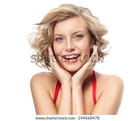 closeup portrait of attractive  caucasian smiling woman blond isolated on white studio shot lips toothy smile face hair head and shoulders looking at camera blue eyes tooth