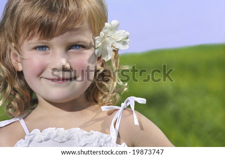 closeup portrait of beautiful little girl, child, outdoors, smiling, looking at camera, face, summer