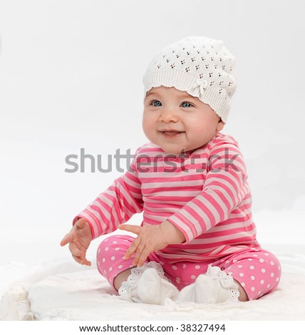 funny baby clothes. sitting in funny clothes