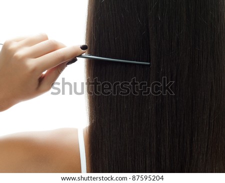 attractive woman standing back long hair brunette with comb