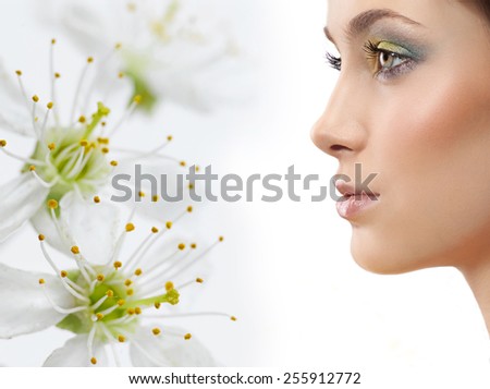 closeup portrait of attractive  caucasian  woman brunette isolated on white studio shot lips face skin makeup hair head  spring flowers