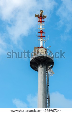Speaker on high tower and blue sky