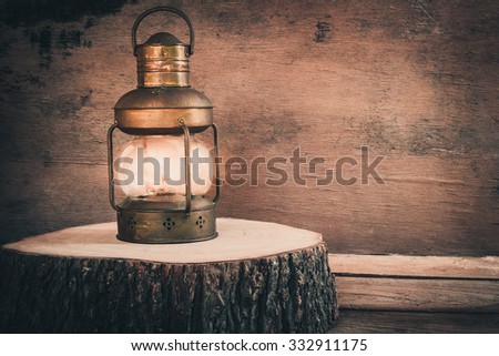 Antique lamp on log wood, Vintage