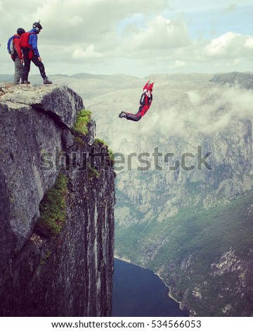 Freedom, flight. BASE Jumping from Kjeragbolten rock in Rogaland, Norway.