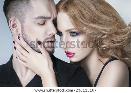 Couple portrait. Beautiful couple in love. Blond woman hugging a man. Valentine couple. Portrait of  beauty blond girl and her handsome boyfriend. Young family. Love. Lovers. Valentines Day