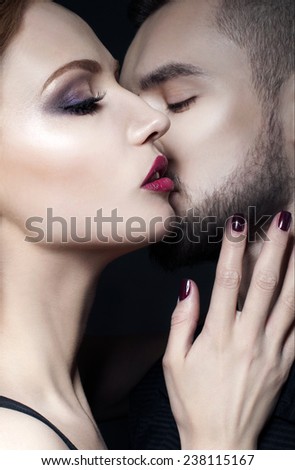 Couple portrait. Passionate couple in love.  Woman hugging a man. Valentine couple. Portrait of  beauty girl and her handsome boyfriend. Love. Kiss. Flirt.  Lovers. Valentines Day