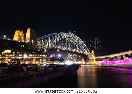 SYDNEY, AUSTRALIA - JUNE 7, 2014:  The Harbour Bridge during Vivid Sydney festival.  Vivid Sydney is an outdoor annual cultural event featuring immersive light installations and projections.