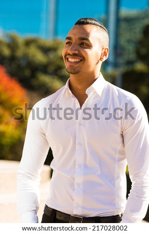 handsome successful man wearing white shirt and smiling