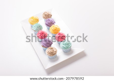 Colorful cupcakes white background