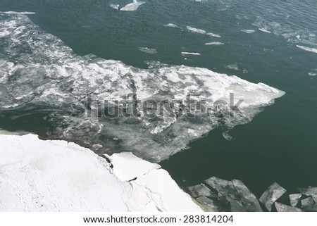 The thawing ice on the river in the spring,