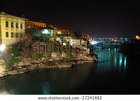 Mostar old town at night with the Luka Bridge above the Neretva river.