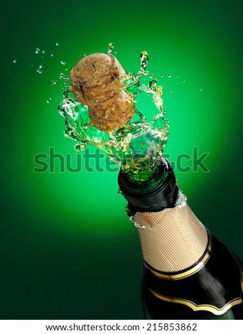 cork flying from bottle of champagne
