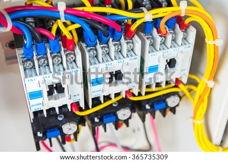 Close up circuit breakers and wire in control panel